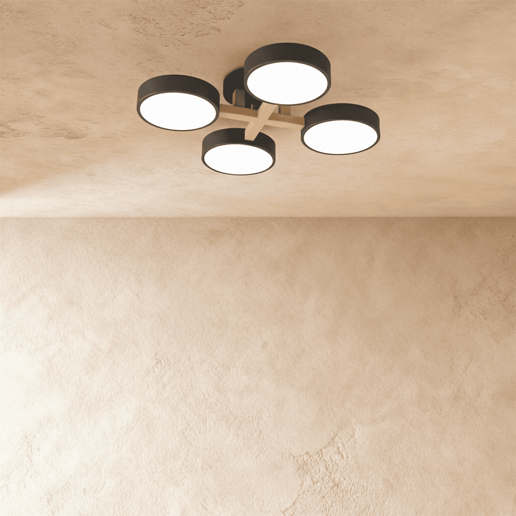 Clérachic's ceiling light in charcoal gray, four drum shades set on a light wood cross arm overhead.