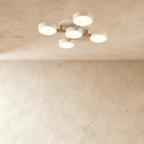 Overhead view of the Clérachic ceiling light in white, its five-head branching design glowing softly above.