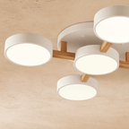 A close detail of the Clérachic ceiling light in white, showing the light wood cross-joint construction.