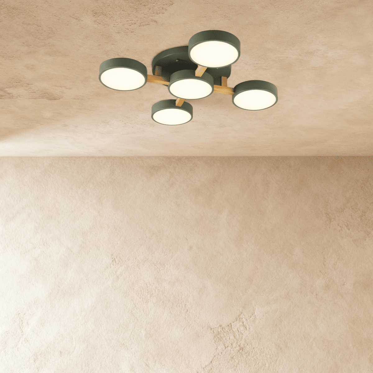 Overhead view of the Clérachic ceiling light in green, its five-head branching design glowing warmly above.