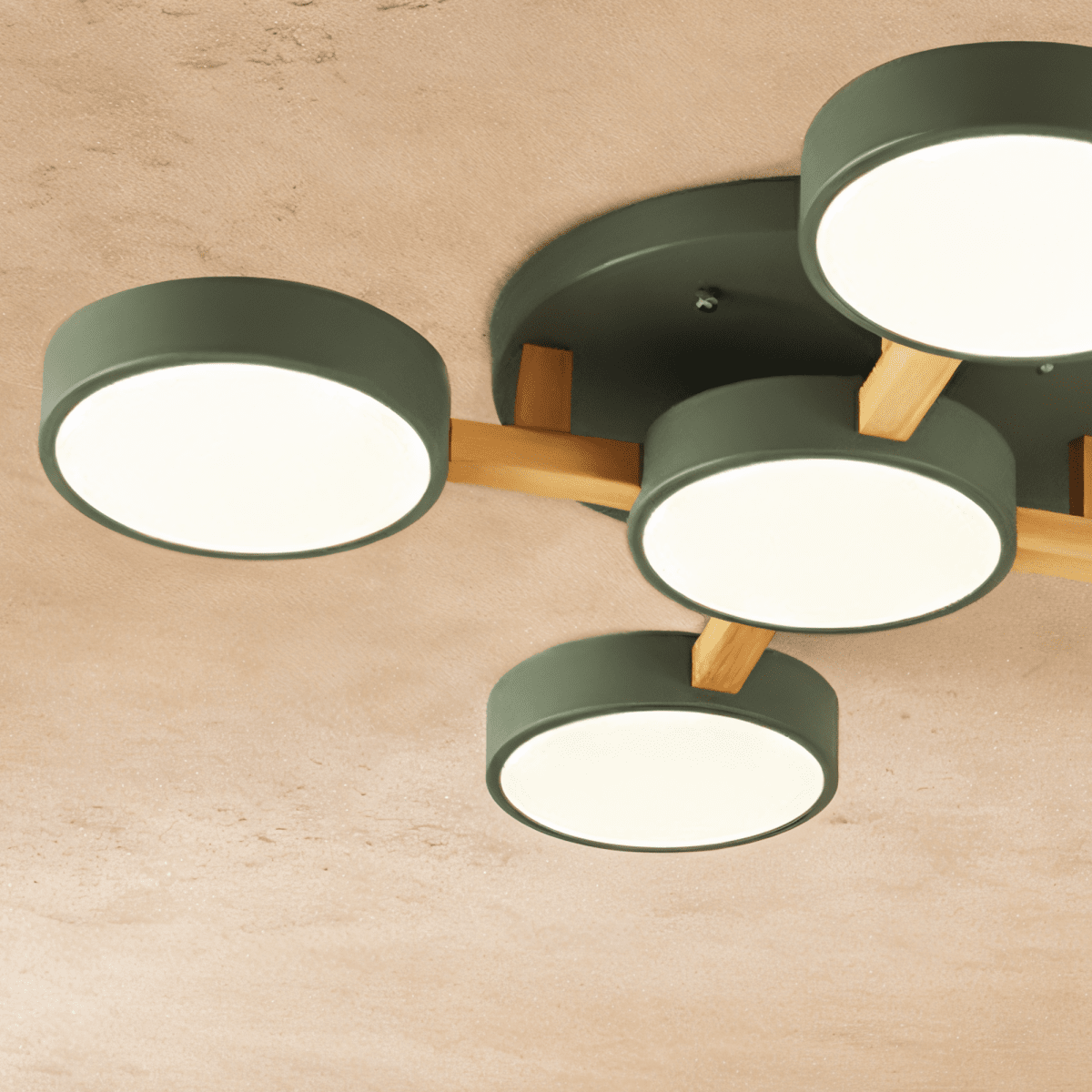 A close detail of the Clérachic ceiling light in green, showing the light wood cross-joint construction.