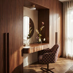 The Clérachic ceiling light in white, a single flush-mount fixture glowing above a walnut dressing nook.