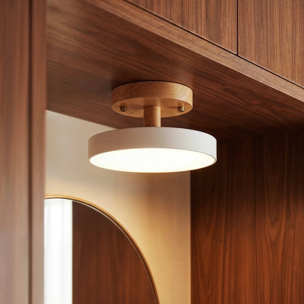 A close lifestyle view of the Clérachic ceiling light in white, mounted beneath a walnut cabinet shelf.