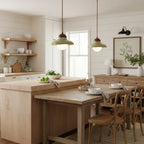 Two Clérachic green ceramic pendants glow in a farmhouse kitchen with open shelves and a butcher-block island.