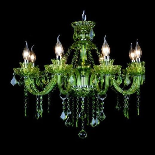 Clérachic eight-arm green glass chandelier with candle bulbs and strings of green crystal, shown lit on a black backdrop.