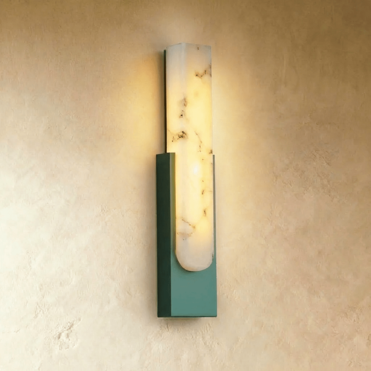 Clérachic green-framed alabaster wall sconce, the stone panel glowing above a sage green painted iron base.