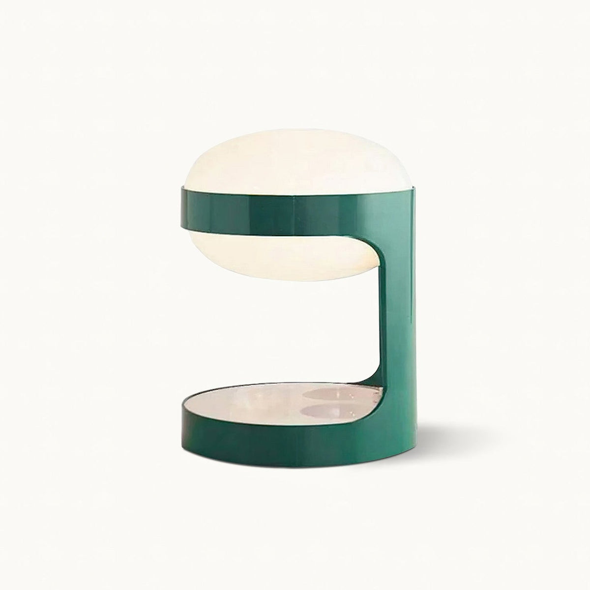 Clérachic table lamp on a plain white backdrop, a green metal cylinder cut open at the middle with a pale dome shade on top.
