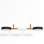 Clérachic's three-drum pendant hangs with dark outer shades and a white center on angled hanging cords.