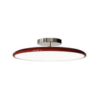 Studio shot of the Clérachic red LED disc ceiling light on a white background, showing its chrome mounting stem.
