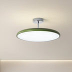 Clérachic green LED disc ceiling light shown at an angle against a plain wall, highlighting its chrome stem mount.