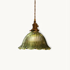 Green ribbed glass pendant with a frilled rim and brass fitting on a twisted cord, shown on a plain white backdrop from Clérachic.