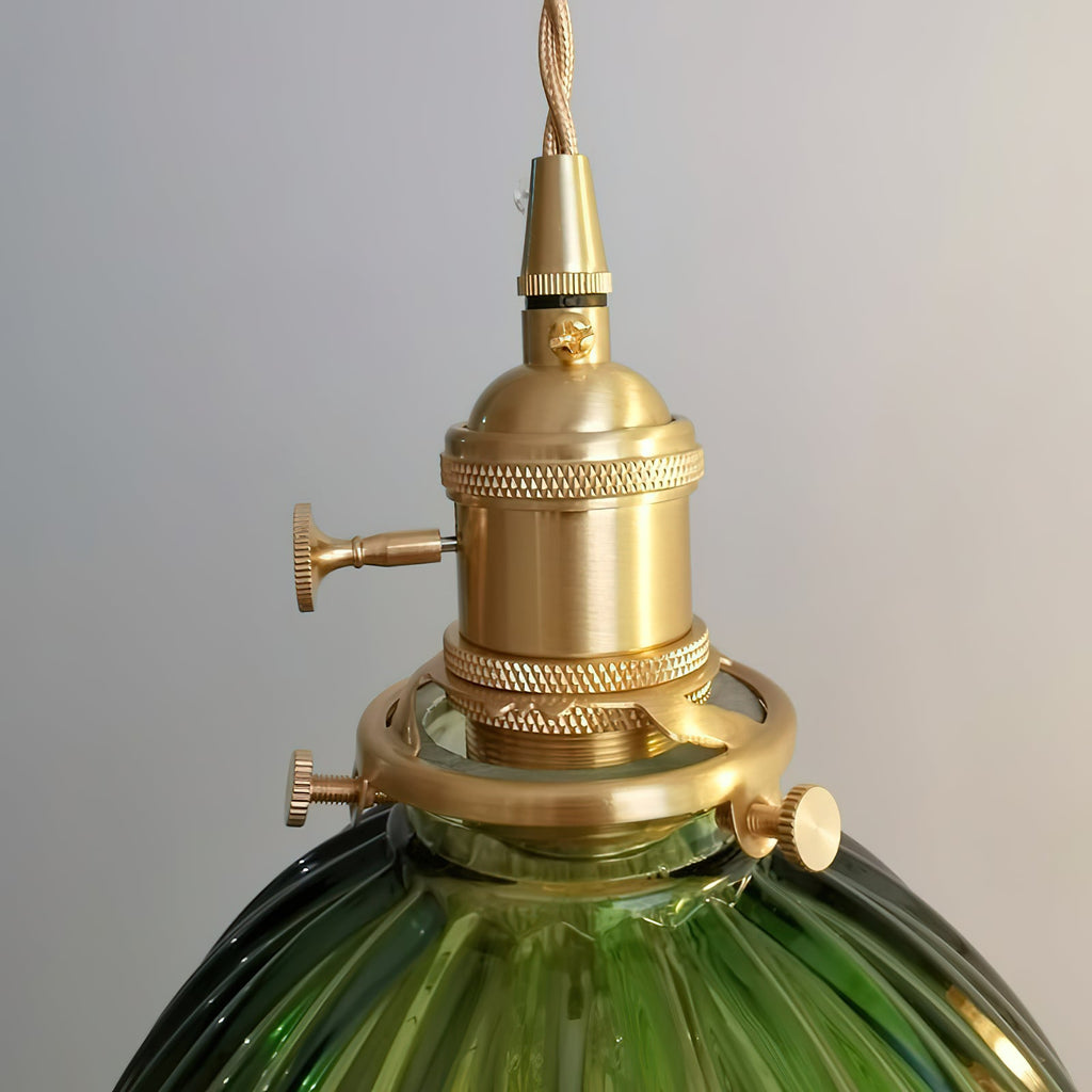 Close view of the brass socket, collar and fixing screws holding the dark-green ribbed shade on this Clérachic pendant.