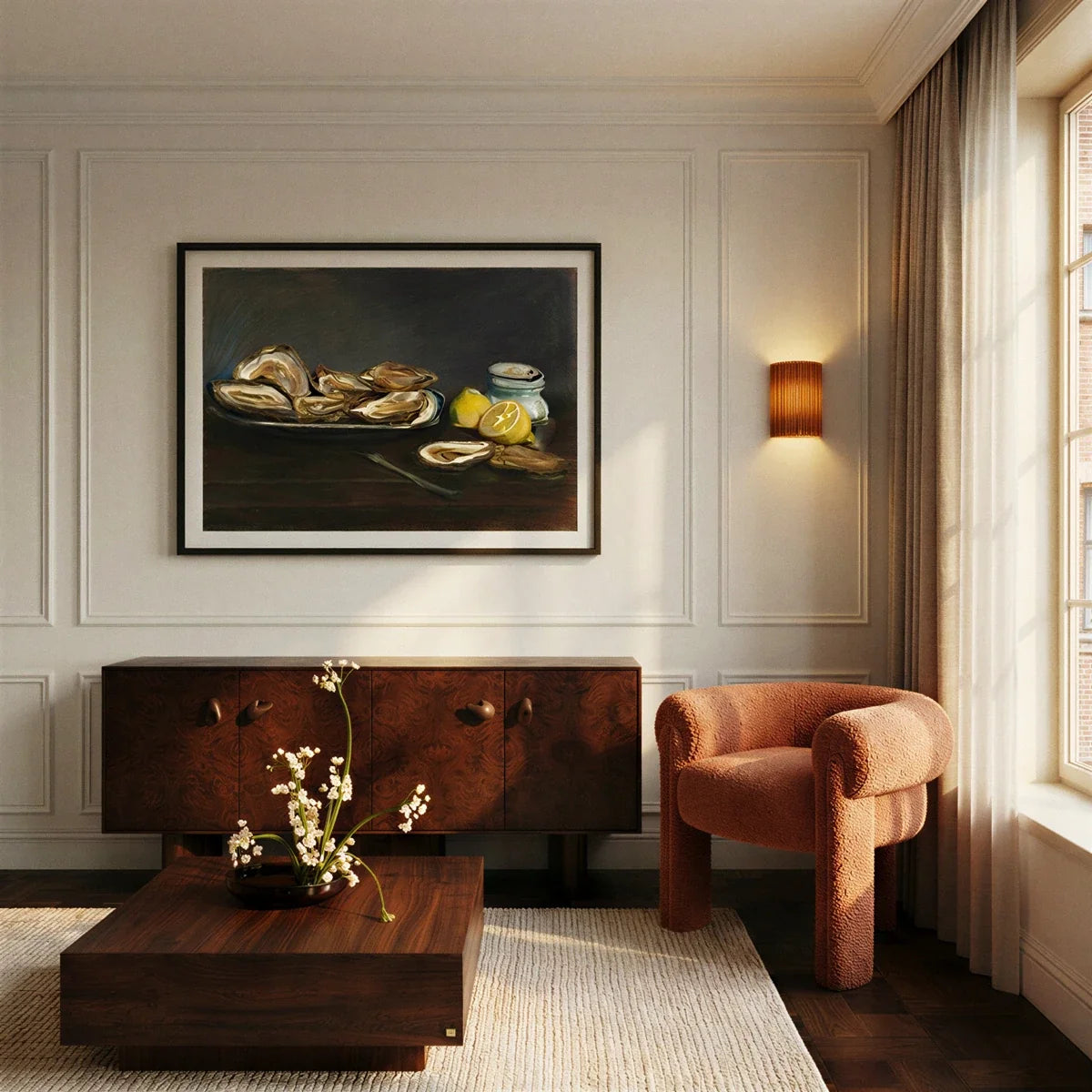 Clérachic wall lamp in burnt orange lit warm beside a still-life painting, sideboard and boucle armchair.