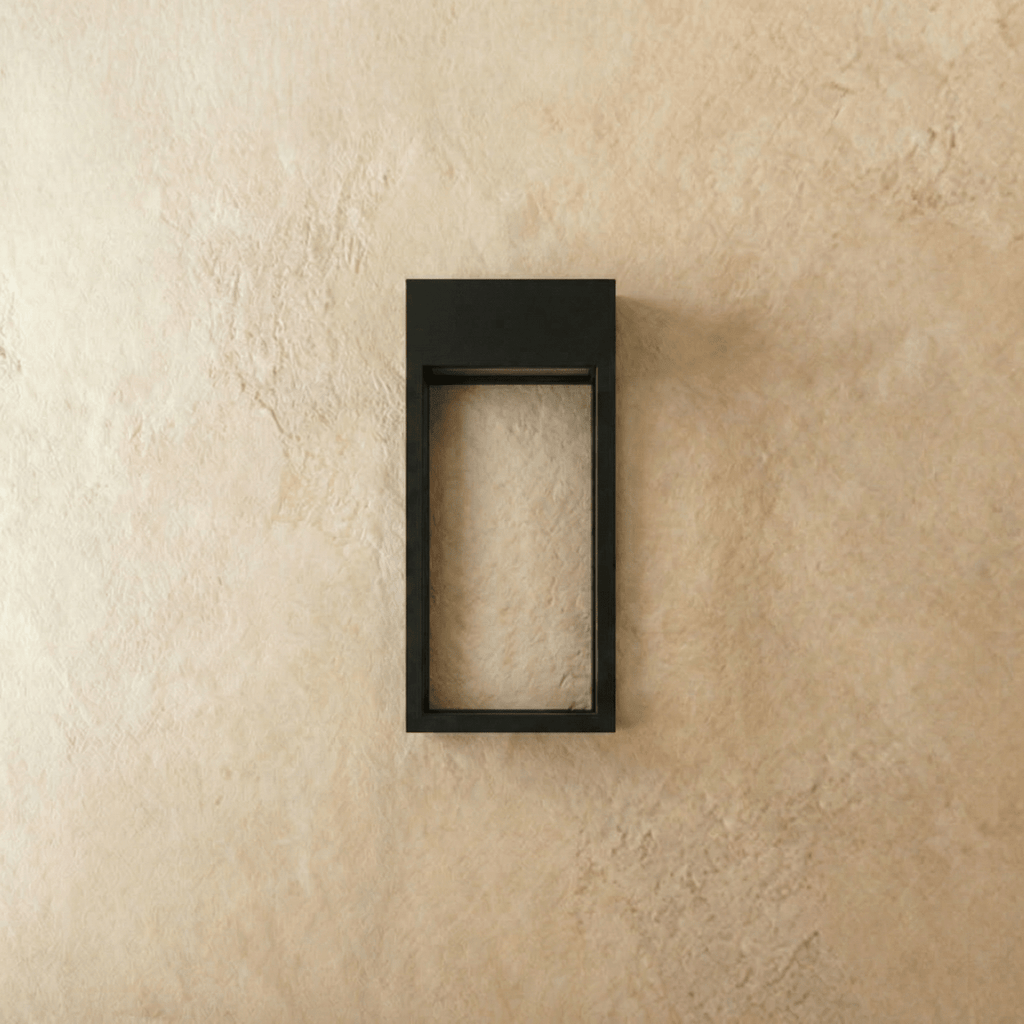 Clérachic grey steel wall sconce frame shown empty and unlit, mounted square against a plain plaster wall.
