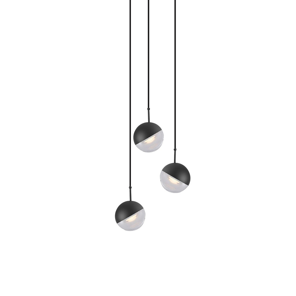 Three matt black Clérachic globe pendants with frosted lower halves, hung at staggered heights on a white backdrop.