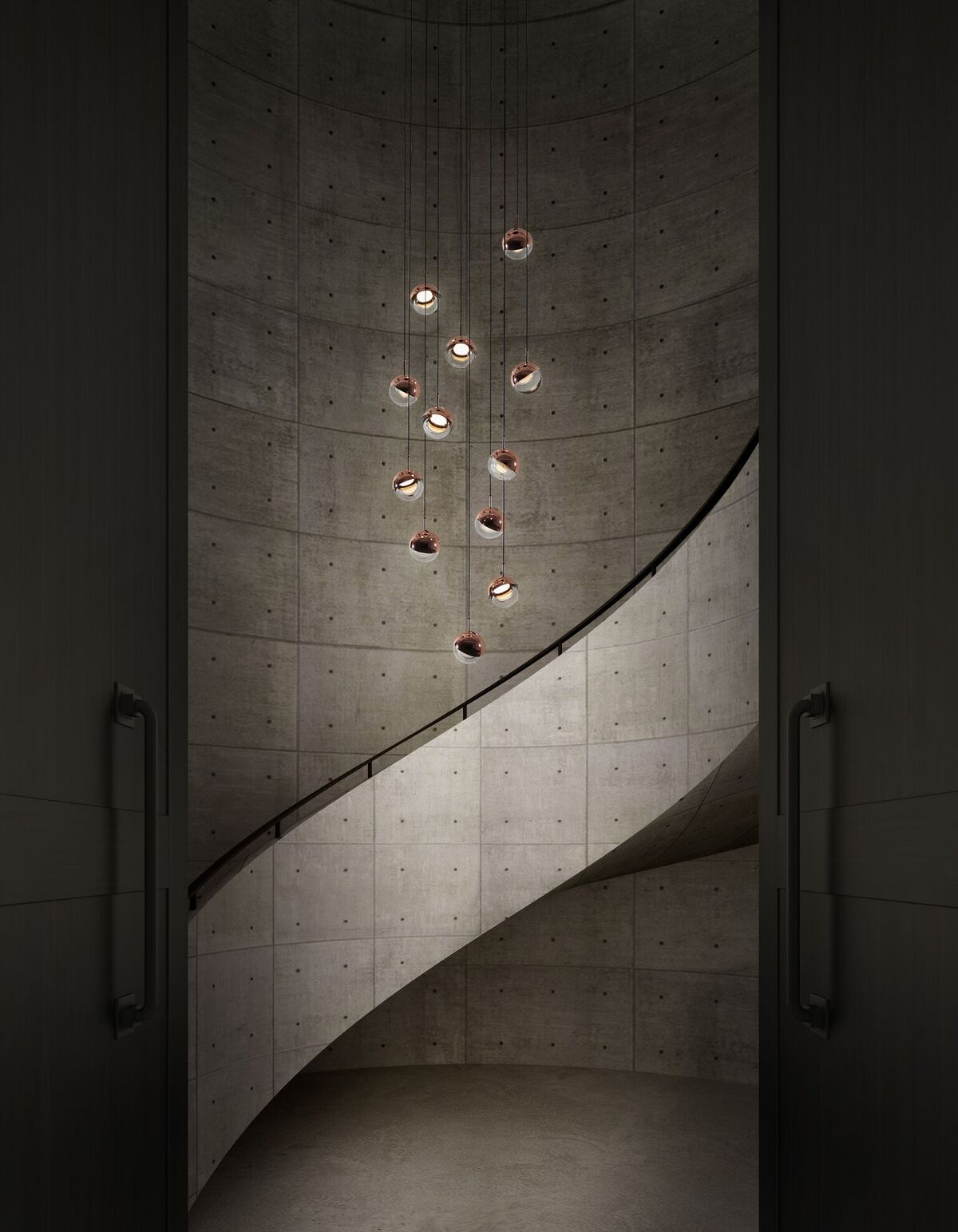Small Clérachic globe pendants hung at stepped heights down a curved concrete stairwell, with a dark door either side.