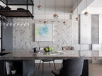 Row of small Clérachic globe pendants above a stone-topped table, with a glass rack and an abstract painting on a herringbone wall.