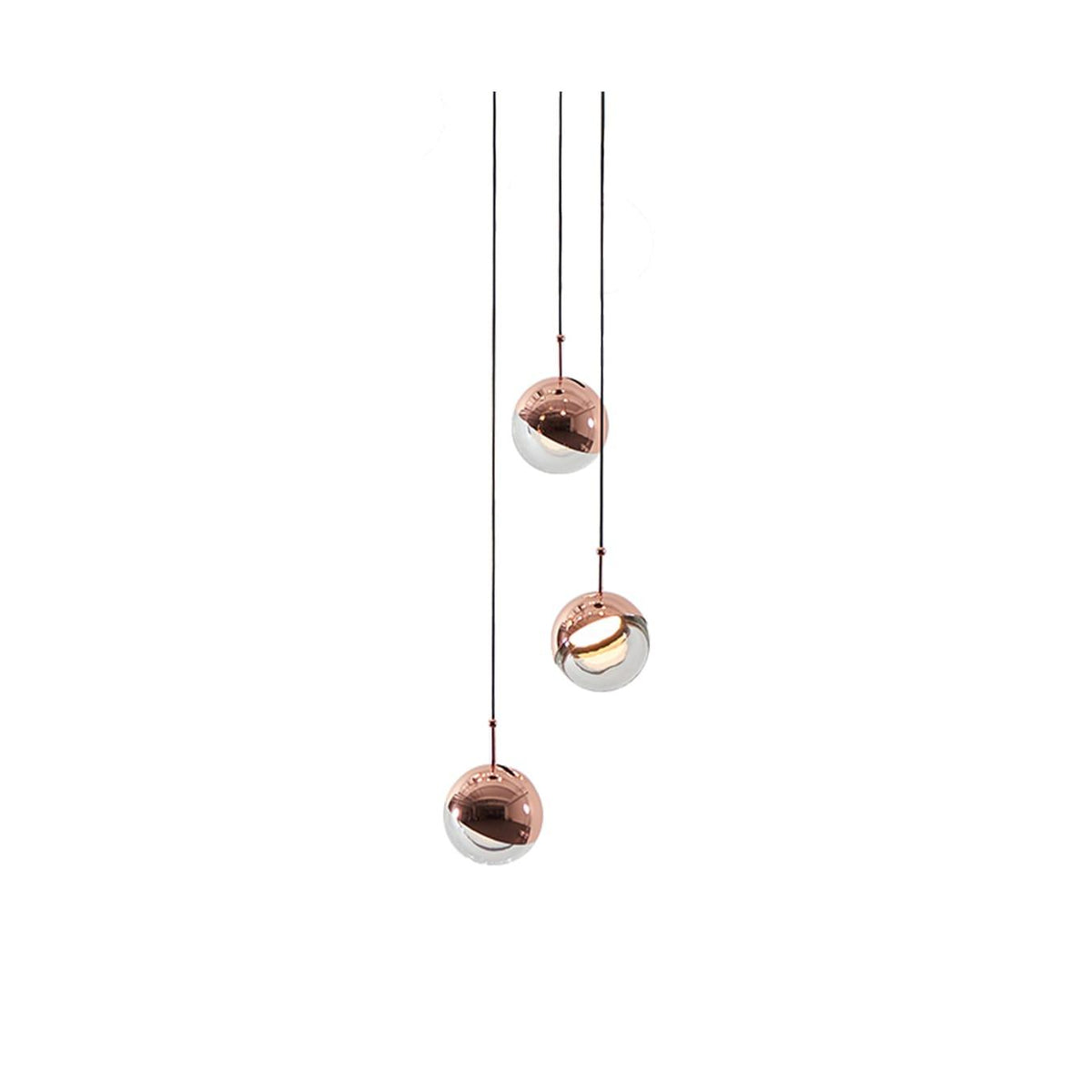 Three rose gold Clérachic globe pendants at different heights on thin cords, on a plain white backdrop.