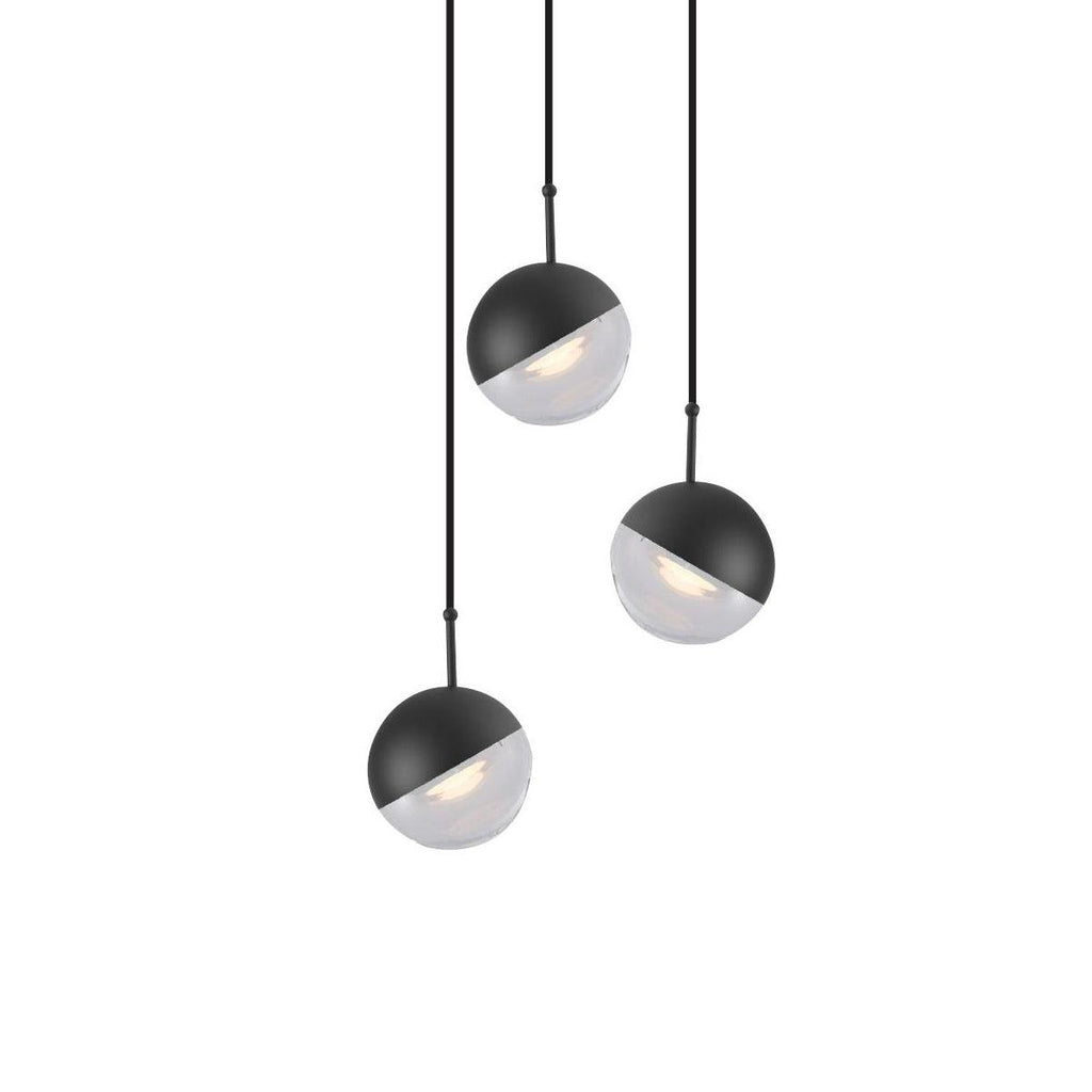 Three matt black Clérachic globe pendants with clear lower halves, hung at staggered heights on a white backdrop.