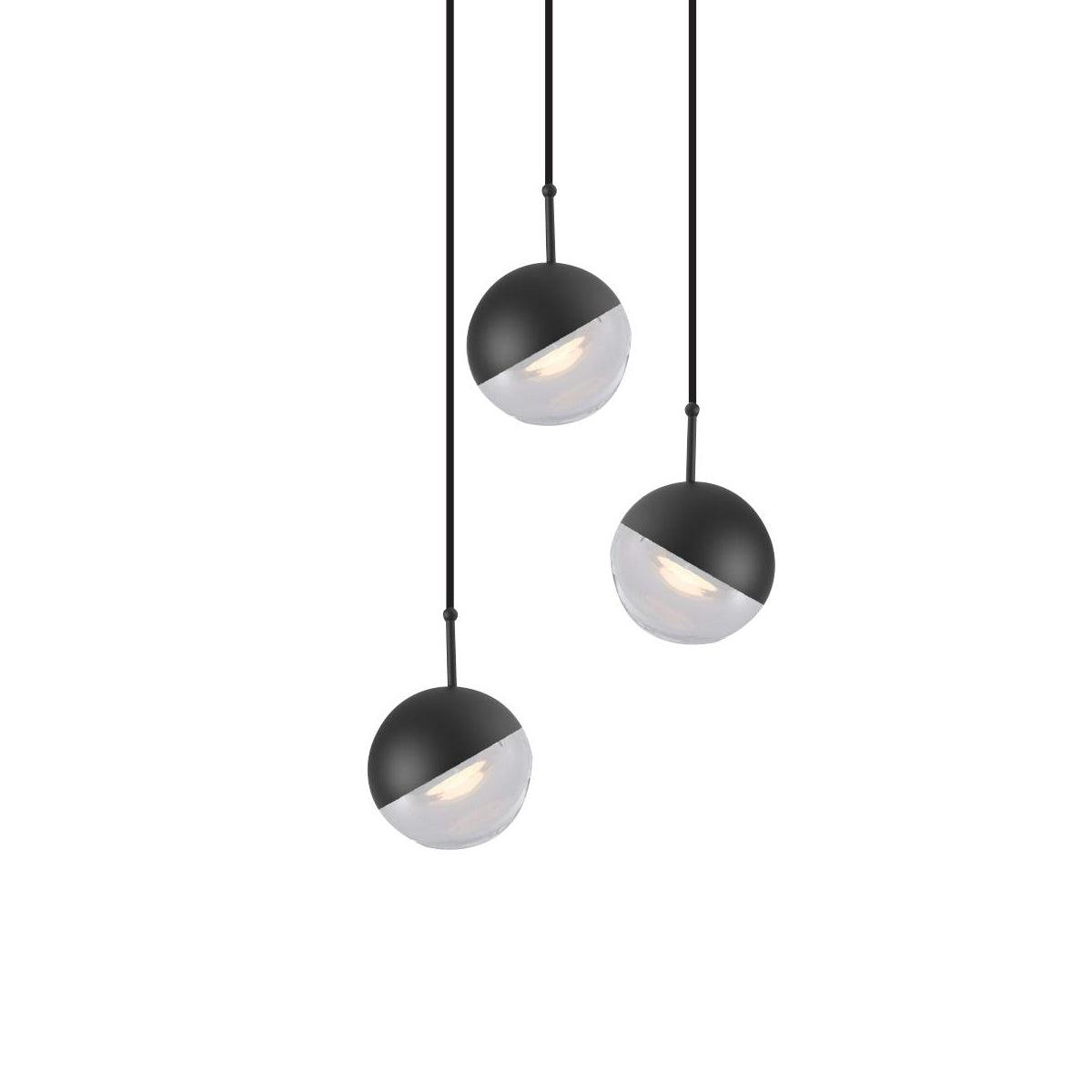 Three matt black Clérachic globe pendants with clear lower halves, hung at staggered heights on a white backdrop.