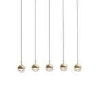 Five small gold-finish Clérachic globe pendants hung in a straight row on thin black cords, on a white backdrop.