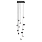 Clérachic pendant cluster with matt black caps hung from a round black ceiling plate, on a white backdrop.