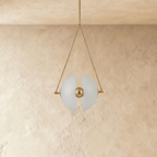 Clérachic unlit pendant of two frosted glass half-discs split by a brass ball, hung from a triangular brass frame.