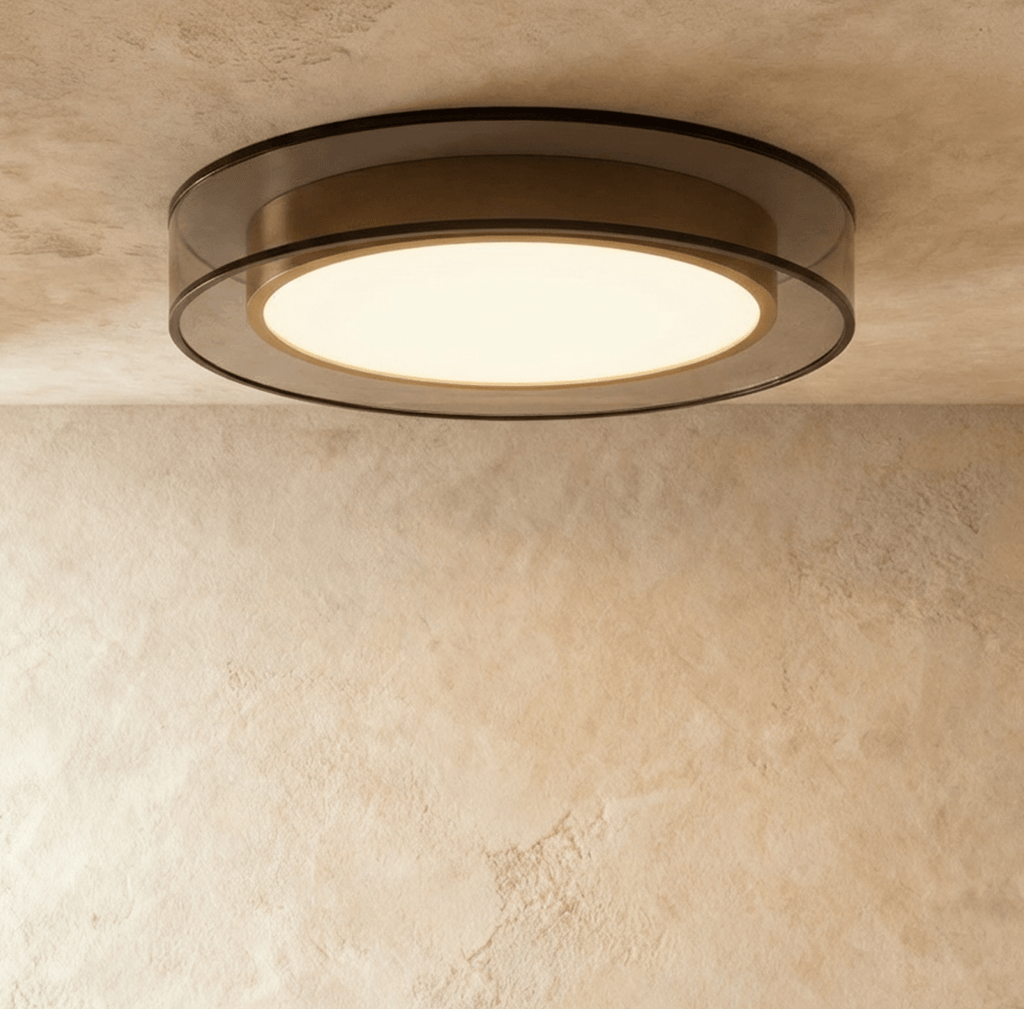 Clérachic halo ring ceiling light viewed straight on, a warm white disc glowing inside a slim black ring.