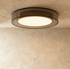 Clérachic halo ring ceiling light viewed straight on, a warm white disc glowing inside a slim black ring.