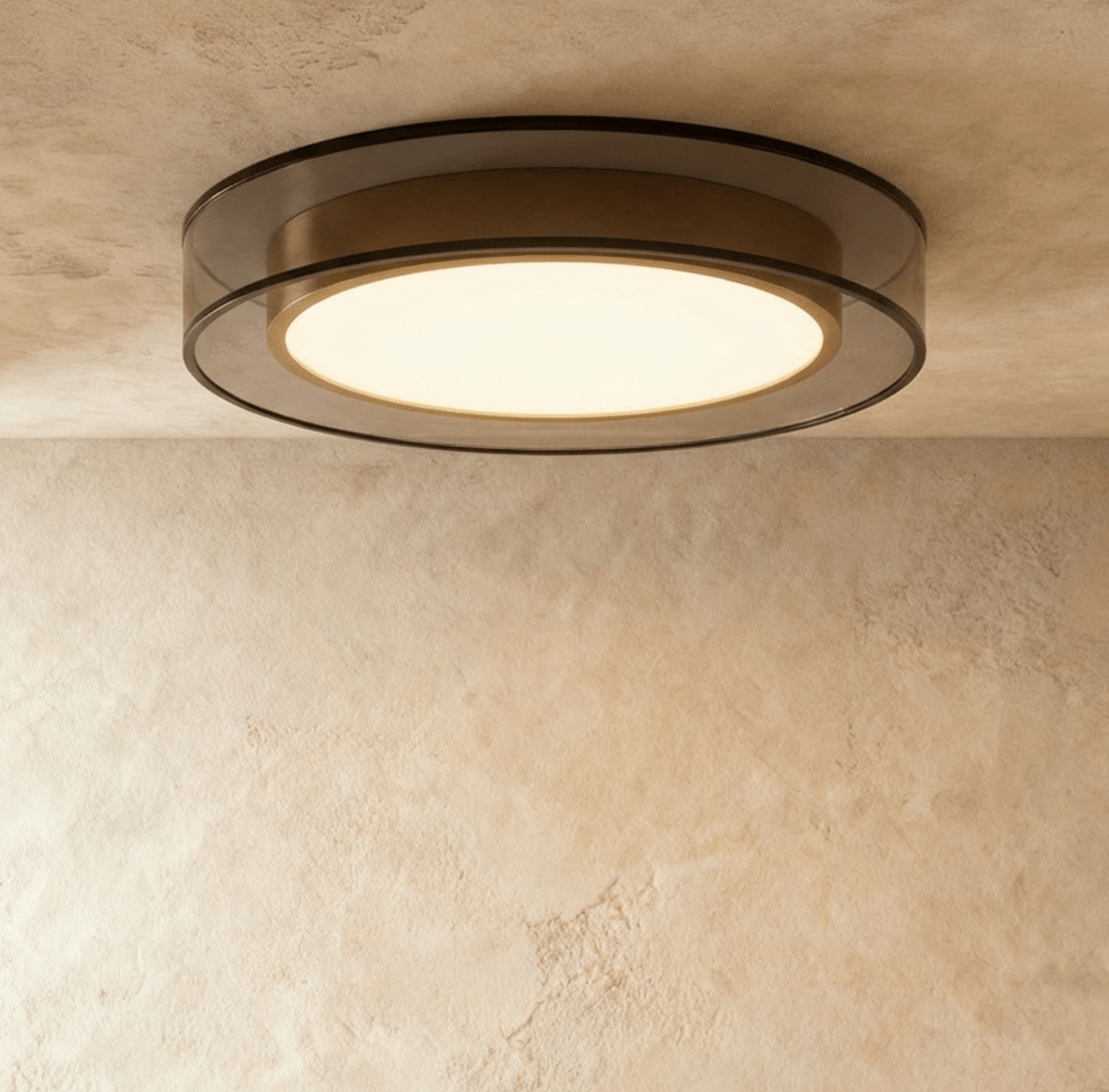 Clérachic halo ring ceiling light viewed straight on, a warm white disc glowing inside a slim black ring.
