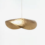 Unlit and shown larger, this Clérachic hammered brass shade sits against a plain white backdrop.