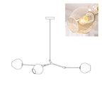 Outline of the 3-head Clérachic chandelier on white, paired with a small photo of a lit amber glass globe.