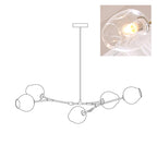 Outline of the 5-head Clérachic chandelier on white, paired with a small photo of a lit clear glass globe, a second view of the same drawing.