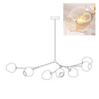 Outline of the 7-head Clérachic chandelier on white, paired with a small photo of a lit amber glass globe.