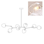 Line drawing of this Clérachic chandelier in its 8-head size, with an inset close view of a clear glass globe.
