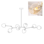 Outline of the 8-head Clérachic chandelier on white, paired with a small photo of a lit amber glass globe.