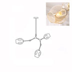 Inset close view of an amber glass globe lit from within, beside the line drawing of this Clérachic 3-head chandelier.