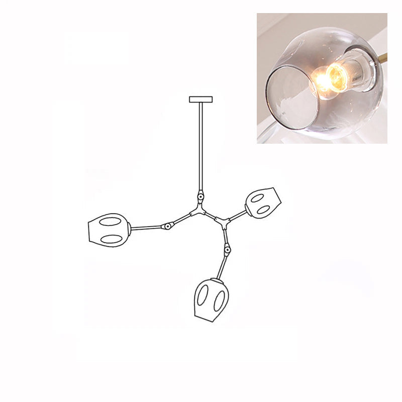 A lit, smoky grey glass globe in a close inset, next to the outline drawing of this 3-head Clérachic chandelier.