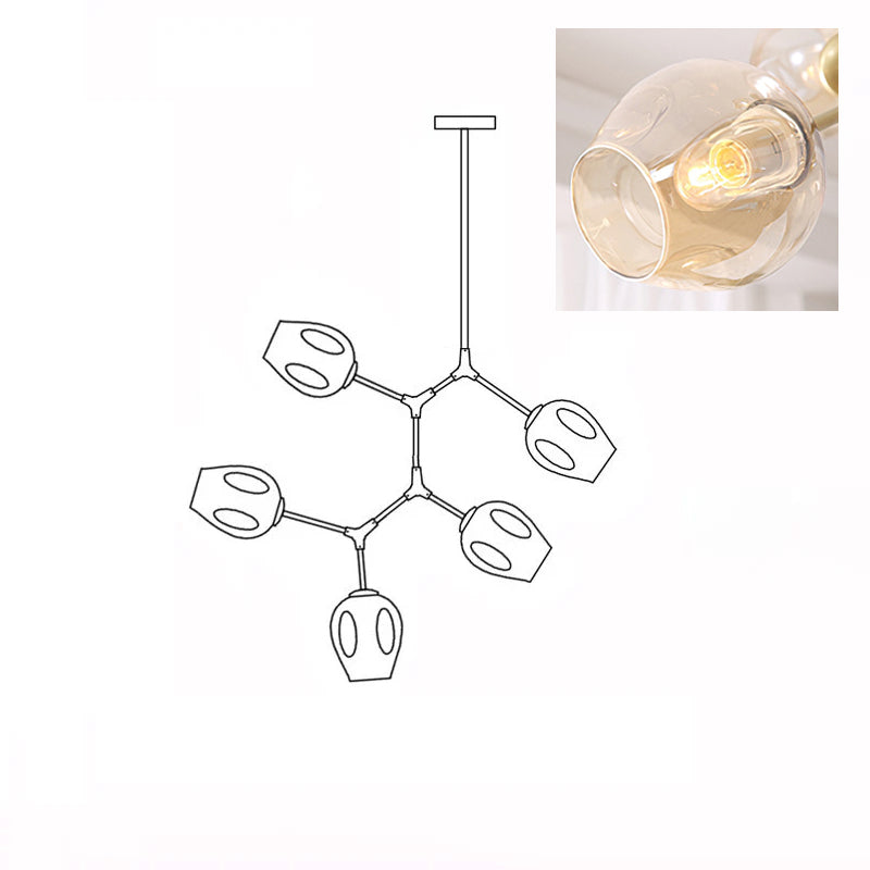 Inset close view of an amber glass globe lit from within, beside the line drawing of this Clérachic 5-head chandelier.