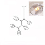 A lit, smoky grey glass globe in a close inset, next to the outline drawing of this 5-head Clérachic chandelier.