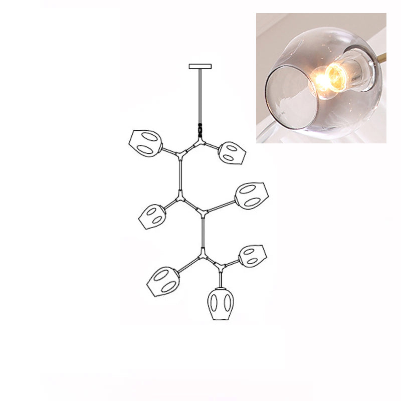 A lit, smoky grey glass globe in a close inset, next to the outline drawing of this 7-head Clérachic chandelier.