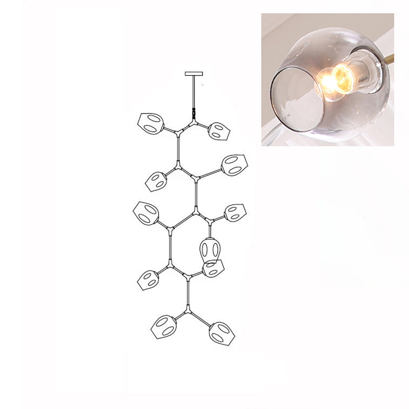 A lit, smoky grey glass globe in a close inset, next to the outline drawing of this 11-head Clérachic chandelier.
