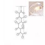 Line drawing of the 12-head Clérachic chandelier, with an inset close view of a lit clear glass globe.