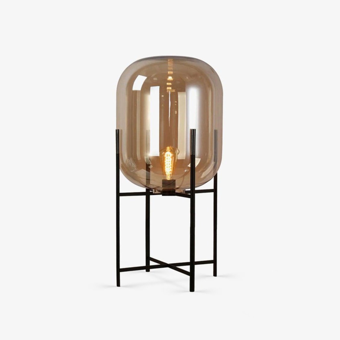 Smoked-amber glass shade on a slim black metal stand, shown on a plain white backdrop for this Clérachic table lamp.