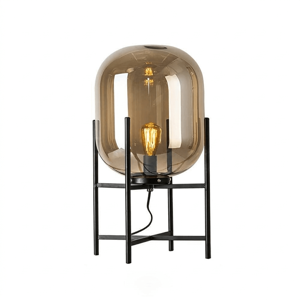 Light brown-amber glass shade with a lit filament bulb on a black frame, shown on a white backdrop for this Clérachic lamp.