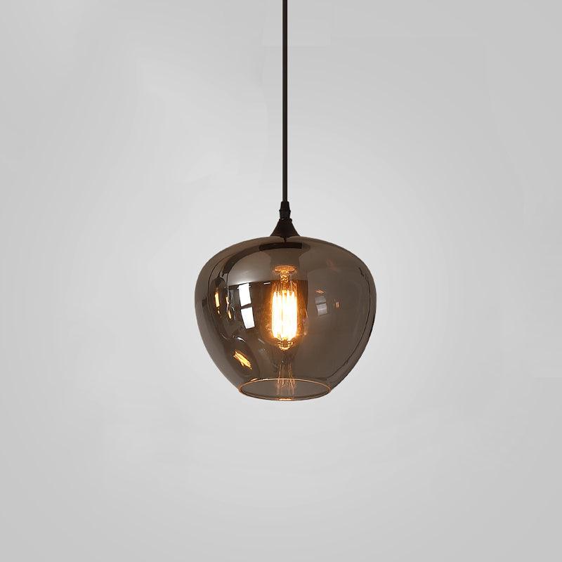 Deep apple-bowl Clérachic smoked glass pendant, open at the base so the light drops straight down.