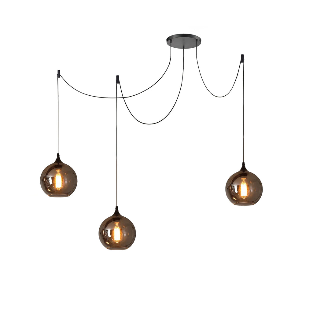 Three globe Clérachic smoked glass pendants from a single spider canopy, cords fanning out to three drop points.