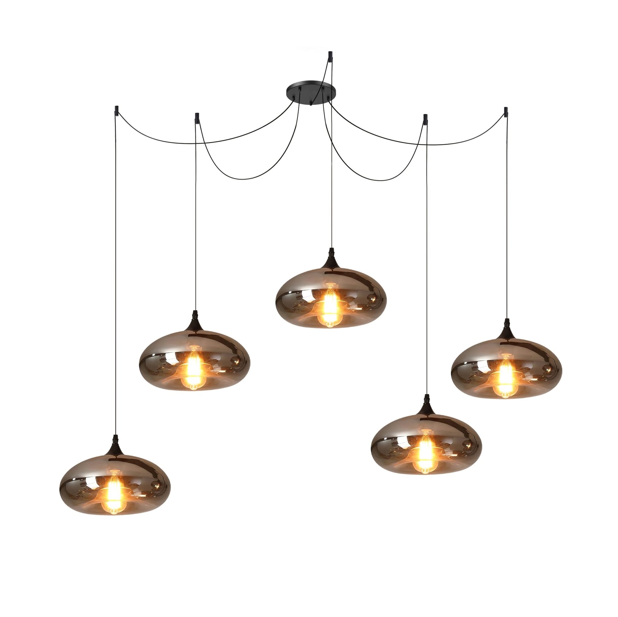 Five flattened disc Clérachic smoked glass pendants staggered across a spider canopy for a wide table run.