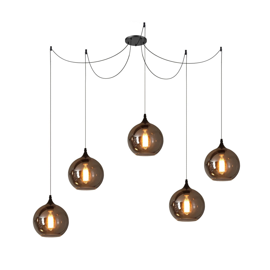 Five globe Clérachic smoked glass pendants on a five-cord spider canopy, hung at varied heights and all lit.