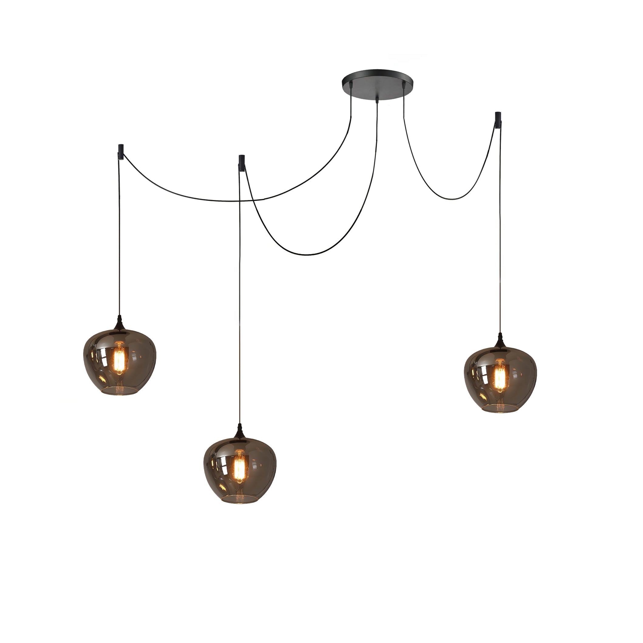 Three apple-bowl Clérachic smoked glass pendants on a spider canopy, hung at staggered heights and lit.